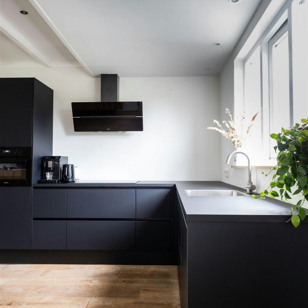 Our modern black kitchen despite being black is very bright.